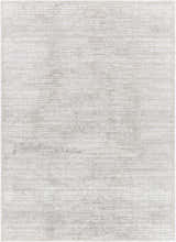 Close up of Arnulf 3D Textured Washable Rug. Cream, ivory, and taupe rug with subtle horizontal lines and textured design. Design-Rectangle-4117