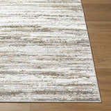 Close-up of the Aminia Area Rug showing its charcoal, gray, and white contemporary stripe design. Front