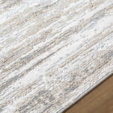 Close-up of the Aminia Area Rug, showcasing its charcoal, gray, and light brown contemporary striped design. Texture