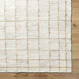 Close-up of the Zared Checkered Jute Area Rug showing its ash and light silver tones and hand woven texture. Swatch