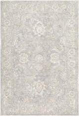 Close-up of the Adriel Slate Blue Area Rug, featuring a traditional floral pattern and soft, muted colors. Design-Rectangle-6796