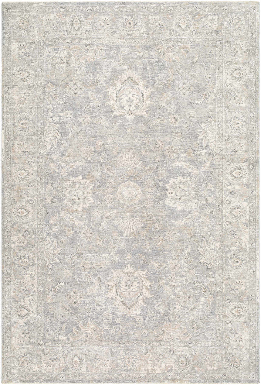 Close-up of the Adriel Slate Blue Area Rug, featuring a traditional floral pattern and soft, muted colors. Design-Rectangle-6796