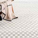 Close-up of the Gaiwan Cream Gray Washable Area Rug featuring a subtle checkerboard pattern and soft texture. Styleshot