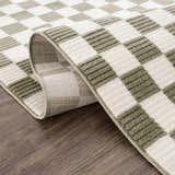 Close-up of the Kaysar Olive Green Checkered Washable Area Rug showing its texture, checkered pattern, and colors. Fold
