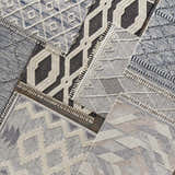Close-up of Hesperus High/Low Pile Rugs with Tassels. Geometric designs in black, ivory, and gray. Bohemian, farmhouse style. Styleshot