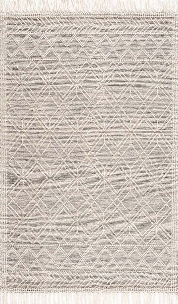 Close-up of the Ramsbury Wool Area Rug. Hand-woven rug with a geometric diamond pattern in black and ivory with fringed edges. Design-Rectangle-576