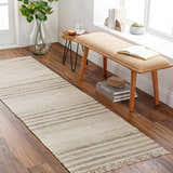 Entryway with a Calinog runner rug in beige, charcoal, and green. Bench and plants add to the Scandinavian farmhouse style. Roomscene-Runner