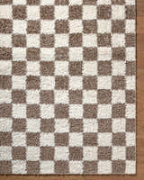 Close-up of the Neftekamsk Area Rug with a brown and ivory checkerboard pattern and soft, textured pile. Swatch