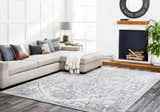 Living room scene with a light gray sectional sofa and the Darfield Area Rug in black and light gray. Roomscene-Rectangle