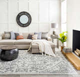 Living room with a light gray sectional sofa and black Darfield Area Rug. Roomscene-Rectangle
