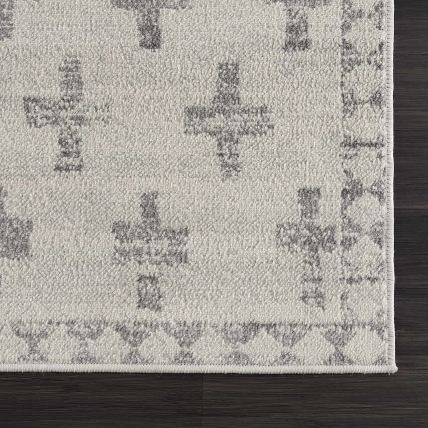 Close-up of the Tigris Swiss Cross Ivory&Gray Area Rug showing the gray geometric cross pattern and soft, textured ivory pile. Swatch