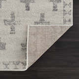 Close-up of the Tigris Swiss Cross Ivory&Gray Area Rug showing the geometric pattern, soft texture, and rug backing. Fold