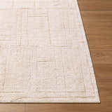 Close-up of Alma Machine Woven EDAL-2301 rug in ivory and taupe on wood floor. Contemporary style, rectangle shape. Front