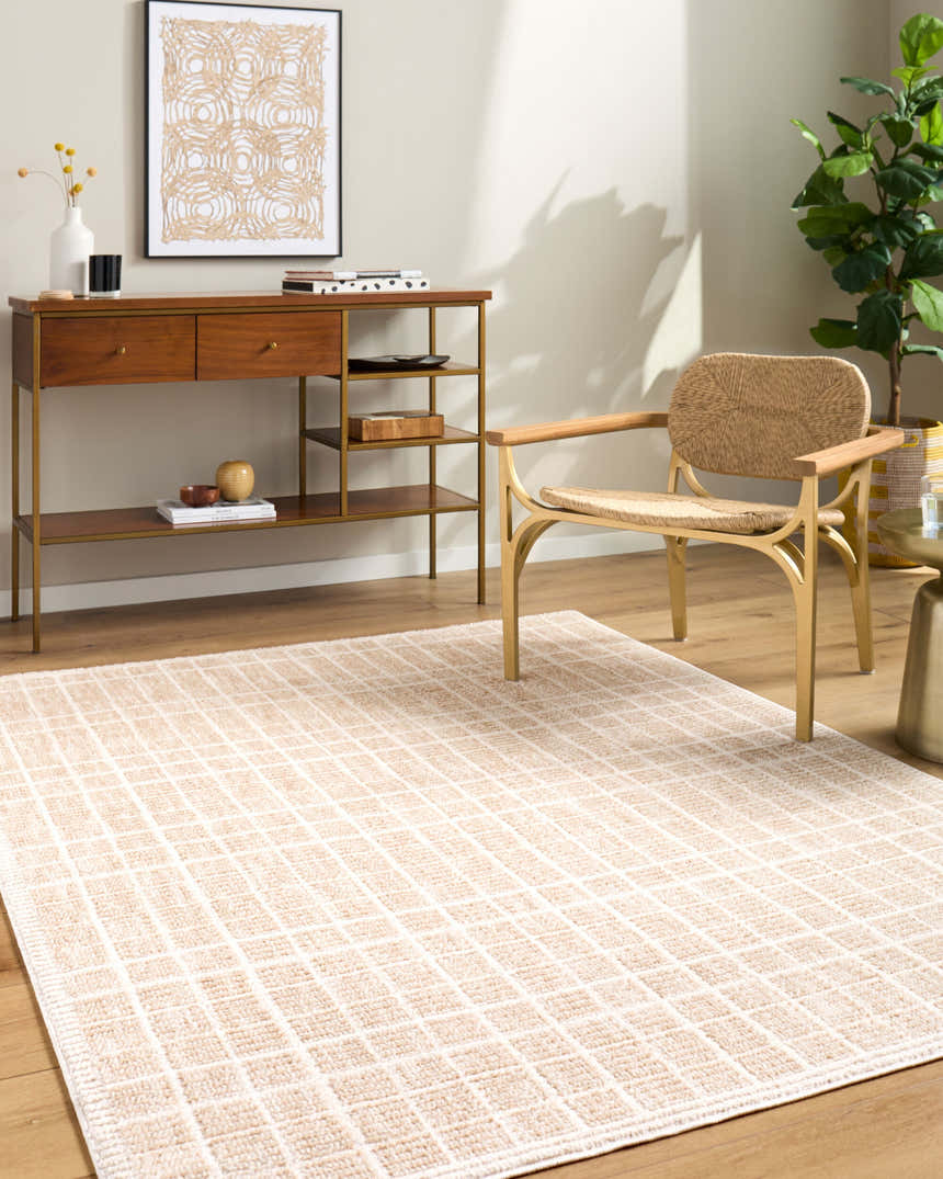 Living room scene with the Odeon Elle Decor x LIVABLISS rug in beige and cream, wood console table, and woven chair. Roomscene-Rectangle