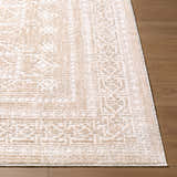Close-up of the Odeon Elle Decor x LIVABLISS EDOD-2303 area rug in beige and ivory, showing the contemporary pattern. Front