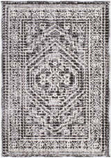 Close-up of the Odeon Elle Decor x LIVABLISS EDOD-2306 Area Rug. Features a contemporary black, charcoal, and cream geometric pattern. Design-Rectangle-221