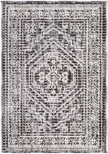 Close-up of the Odeon Elle Decor x LIVABLISS EDOD-2306 Area Rug. Features a contemporary black, charcoal, and cream geometric pattern. Design-Rectangle-221