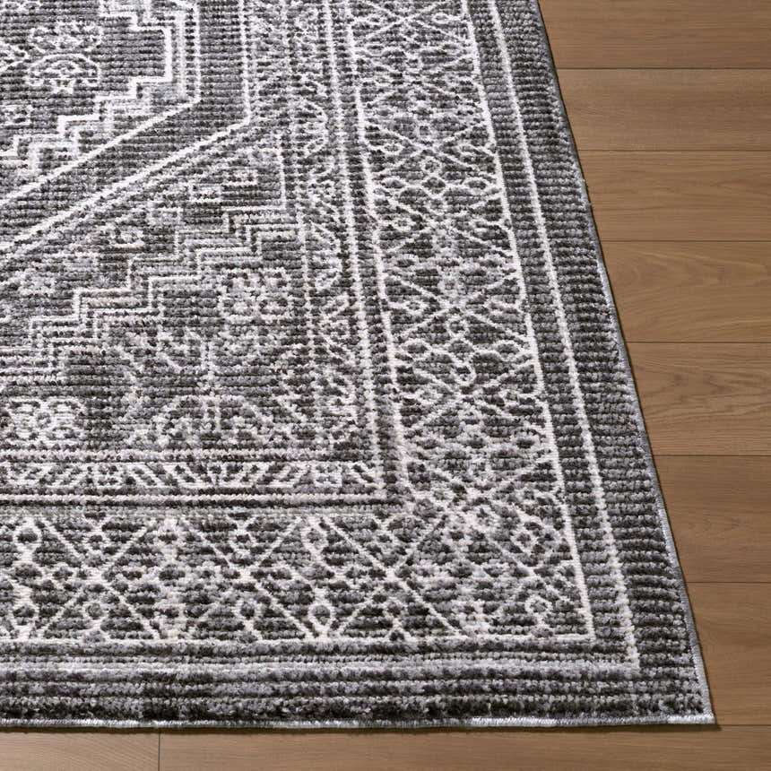 Close-up of the Odeon Elle Decor x LIVABLISS EDOD-2306 Area Rug. Contemporary black, charcoal, and cream geometric design. Front