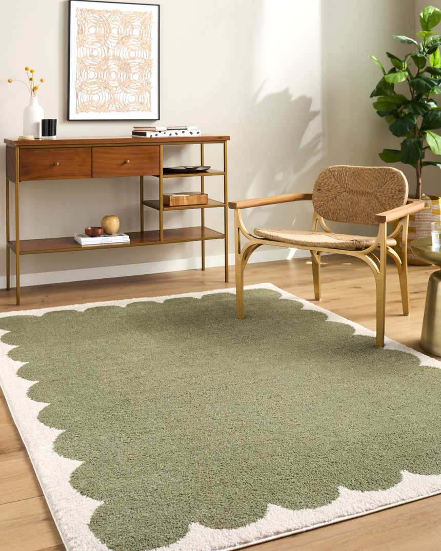 Living room scene with Rivoli Elle Decor x LIVABLISS EDRV-2303 rug in cream and olive, wood console table, and woven chair. Roomscene-Rectangle