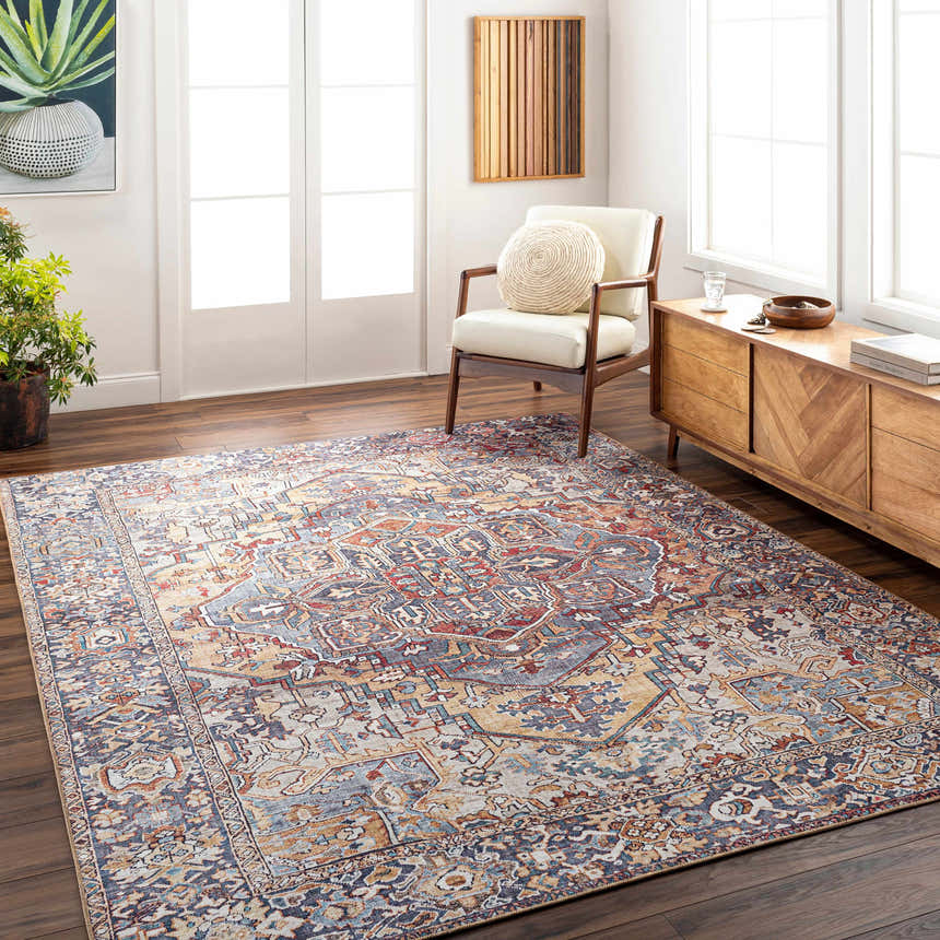 Living room scene with a beige, red, and blue Neyland Iris Area Rug, wood floors, and mid-century modern furniture. Roomscene-Rectangle