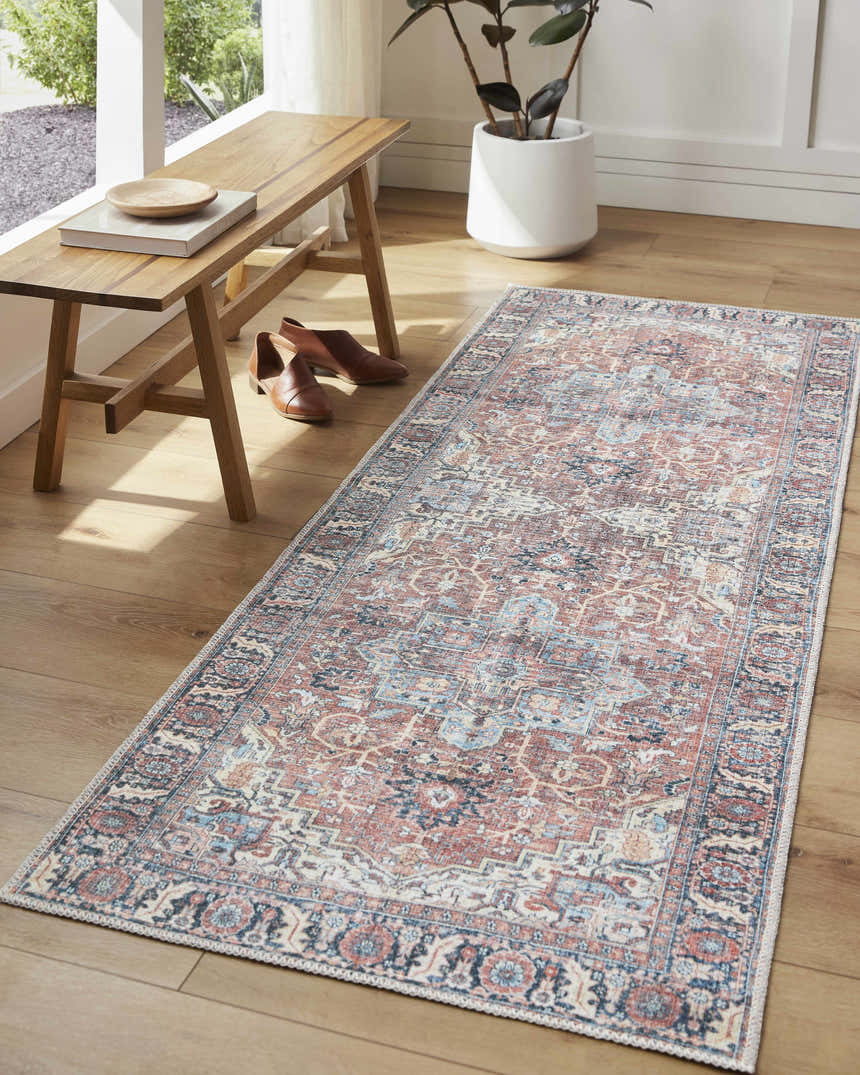 Entryway scene with a vintage style Evony Washable Area Rug in faded driftwood, a wooden bench, and brown shoes. Roomscene-Runner