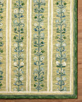 Close-up of the hand-tufted Callen Light Green Area Rug, featuring a floral vine pattern and striped design. 100% wool texture. Front