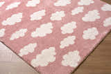 Close-up of the Dawo Pink Abstract rug. Features a pink background with a white cloud pattern and a soft, textured feel. Corner