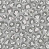 Close-up of the Greensborough Performance Rug showing a gray and white animal print pattern and woven texture. Texture