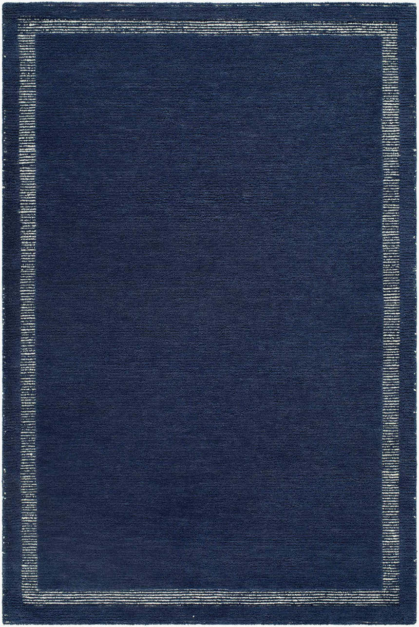 Close-up of the Tufape Modern Minimalist Handmade Area Rug; rectangle shape, slate gray wool with thin purple border. Design-Rectangle-576