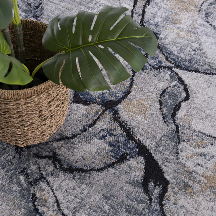 Close-up of the Fremantle Gray Marble Rug, showing cream, gray, gold, and light blue abstract pattern and soft texture. Swatch