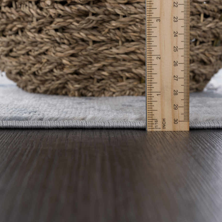 Close-up of the pile height of the Fremantle Gray Marble Rug, showing its construction and texture. Pile