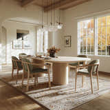 Dining room with an oval table and the Kabungahan Oushak Style Floral Rug in brick red, cream, and light brown. Roomscene-Rectangle