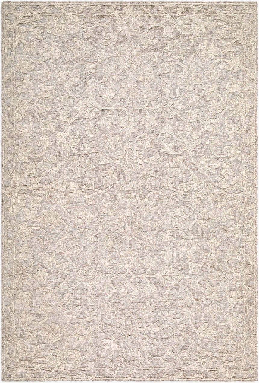 Close-up of the Hiromi Cugydu rug. Hand-tufted wool rug in beige, cream, and taupe with a traditional floral pattern. Design-Rectangle-576