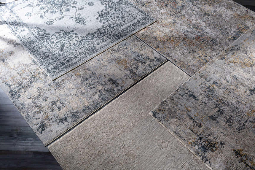 Close-up of Monto Luxe Rugs in charcoal, cream, gray, and taupe. Bohemian, traditional, and contemporary styles. Styleshot