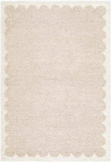 Close-up of the Lytufa Modern Art Deco rug. Hand-tufted wool rug in beige and cream with a scalloped edge. Design-Rectangle