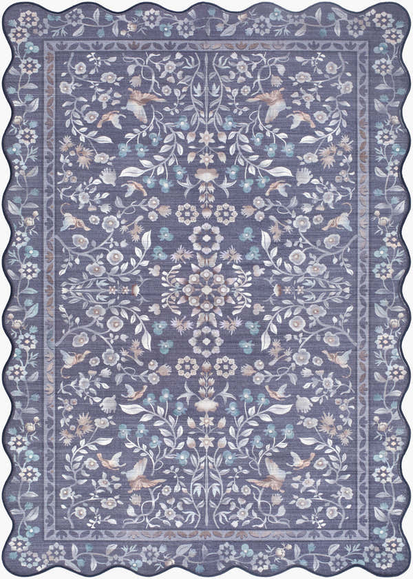 Close-up of the Dascha Washable Area Rug, a blue rug with ivory, gray, and taupe floral and bird pattern and scalloped edge. Design-Rectangle-2339