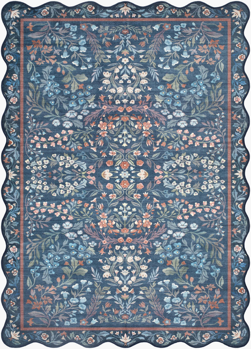 Close-up of the Pepo Blue Floralnature Rug, featuring a blue background and coral, ivory, and sage floral pattern. Scalloped edge. Design-Rectangle-576