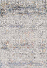 Close-up of the Marden Textured Luxe Area Rug showing its traditional pattern, brick red, cream, and blue hues. Design-Rectangle-573