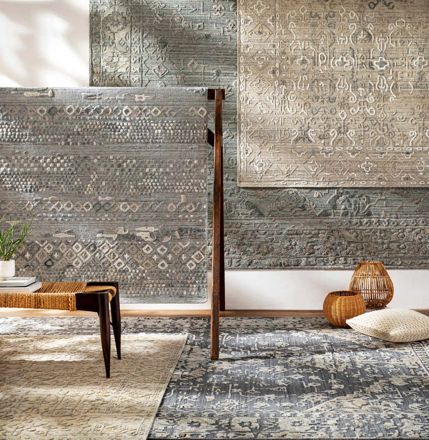 Galchutt Embossed Gray Viscose Wool Rug display. Hand loomed rugs in charcoal, gray, and light gray with embossed patterns. Styleshot