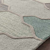 Close-up of the Monteview Sage&Teal Geometric Wool Rug showing its sage, teal, and gray hues and hand-tufted texture. Texture