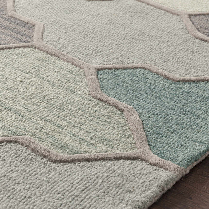 Close-up of the Monteview Sage&Teal Geometric Wool Rug showing its sage, teal, and gray hues and hand-tufted texture. Texture