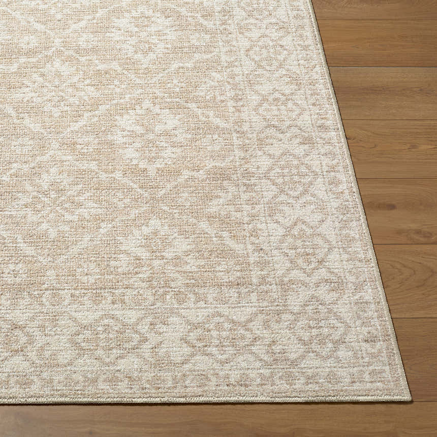 Close-up of Aram Machine Woven Nabela Noor Home x LIVABLISS rug. Ivory, tan, and gray traditional pattern. Front