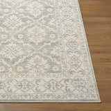 Close-up of the Aram Machine Woven Nabela Noor Home x LIVABLISS NBAR-2304 Area Rug. Beige and gray farmhouse pattern. Front