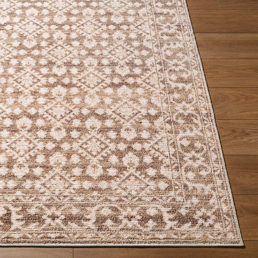 Close-up of the Aram Machine Woven Nabela Noor Home x LIVABLISS NBAR-2307 Area Rug. Brown, gray farmhouse style rug. Front