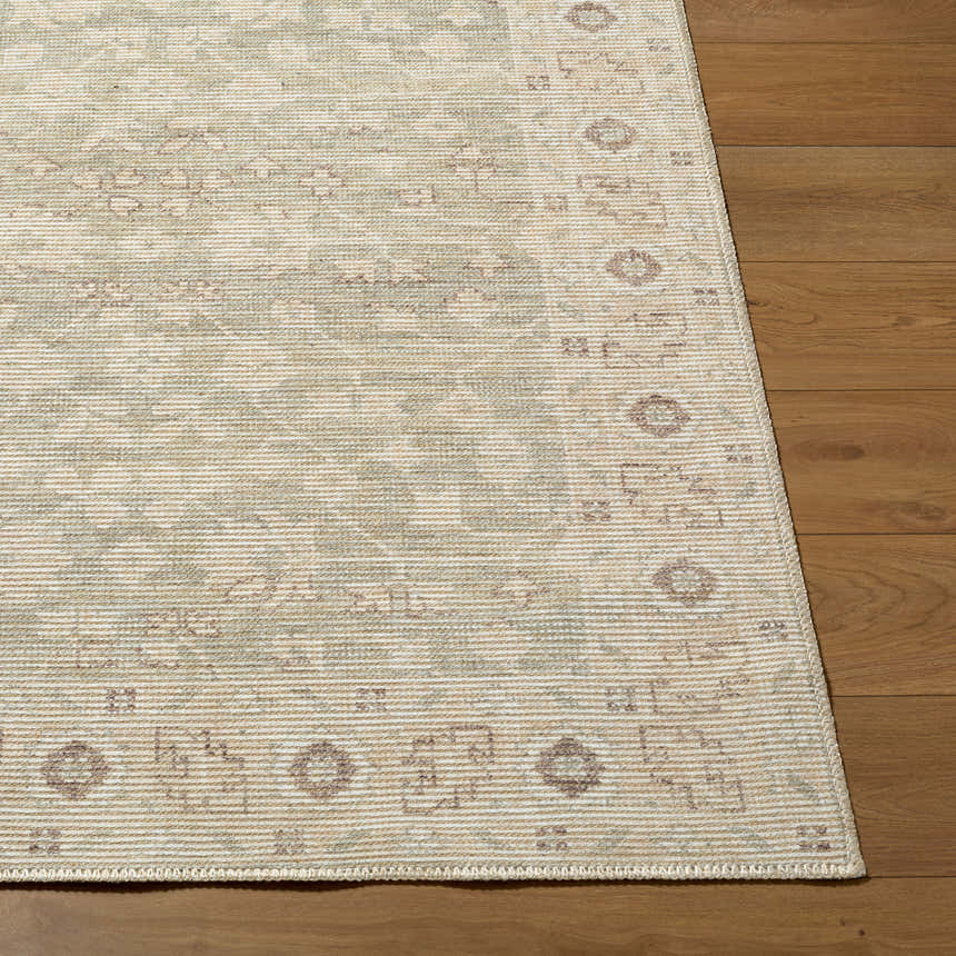 Close-up of Asha Machine Woven Nabela Noor rug showing sage, off-white, and mustard farmhouse pattern and jute-polyester texture. Front