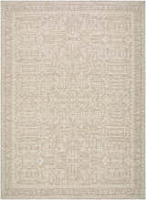 Close-up of Athiyo Machine Woven Nabela Noor Home x LIVABLISS NBAT-2302 Area Rug. Features a traditional pattern in medium gray, mustard, and off-white. Design-Rectangle-679
