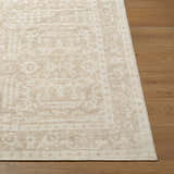 Close-up of the Athiyo Nabela Noor Home x LIVABLISS rug. Jute and polyester rug with a farmhouse-style pattern in gray, mustard, and off-white. Front