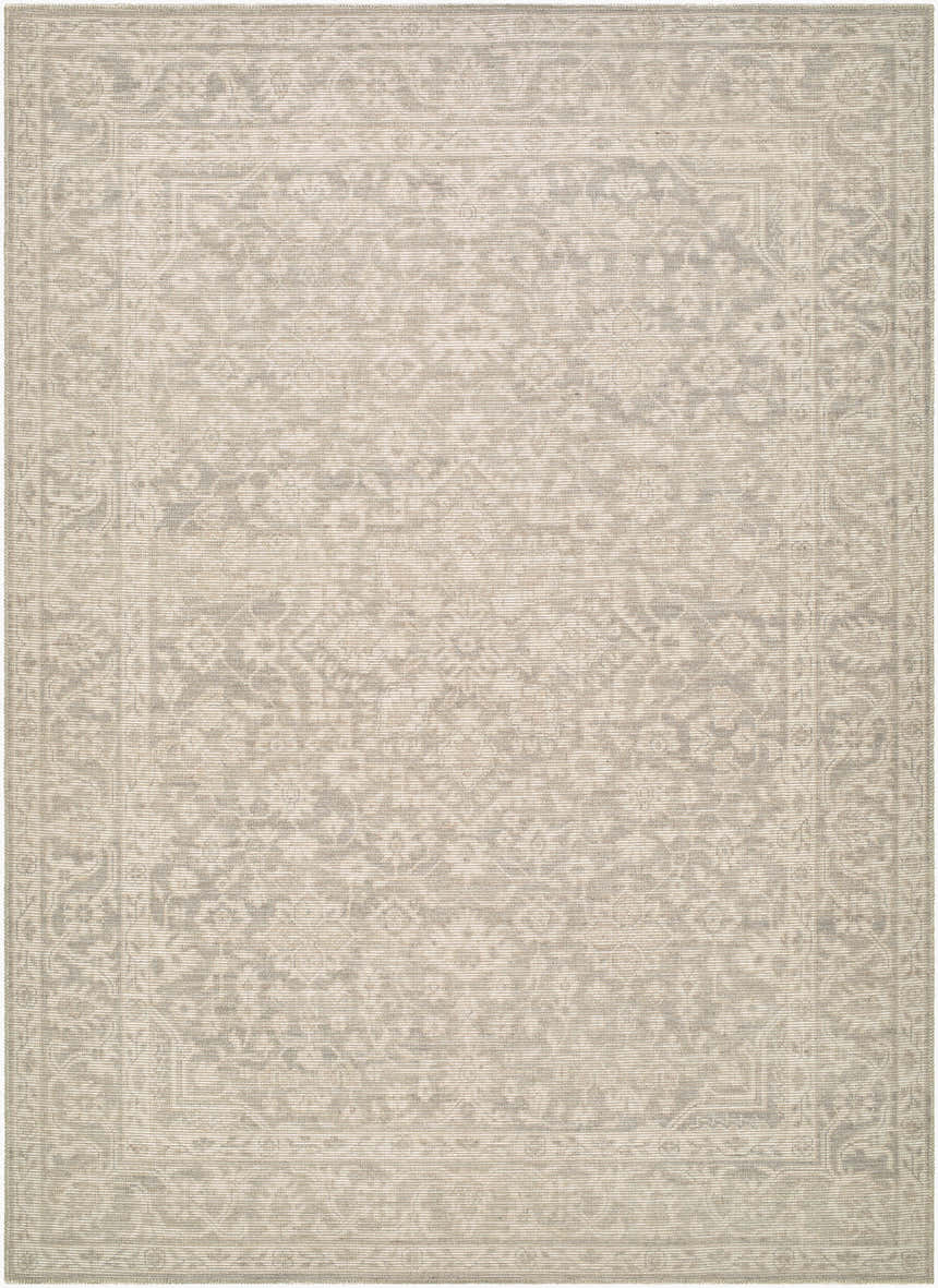 Close-up of the Tenii Gray Persian rug. Machine-woven jute rug with traditional gray and off-white floral pattern. Design-Rectangle-679