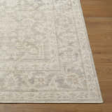 Close up of the Tenii Gray Persian Jute Rug showing texture and pattern on hardwood floor. Front