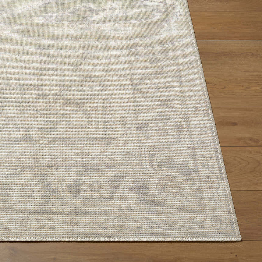 Close up of the Tenii Gray Persian Jute Rug showing texture and pattern on hardwood floor. Front